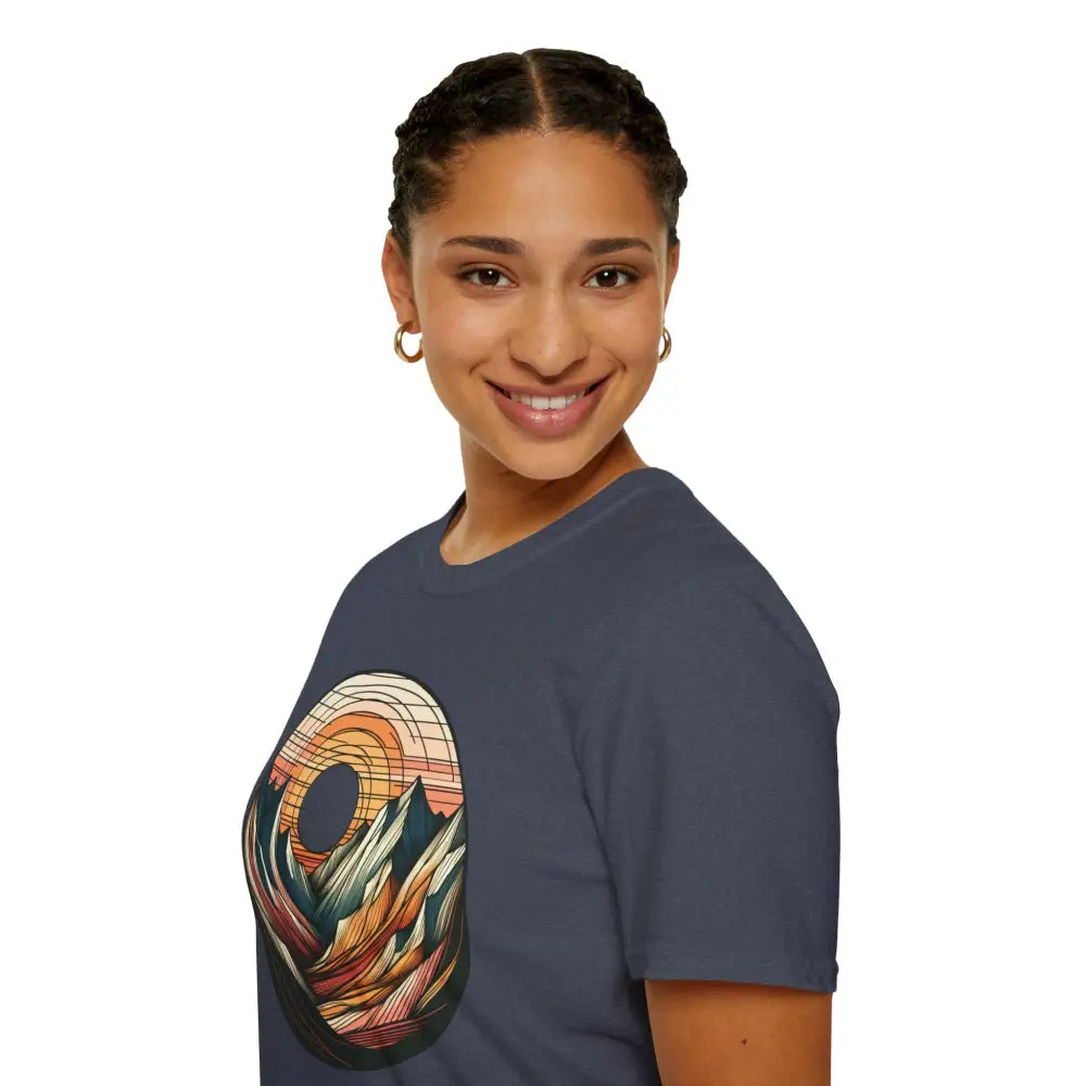 Woman wearing a vintage mountain vibes softstyle t-shirt with colorful sunset graphic