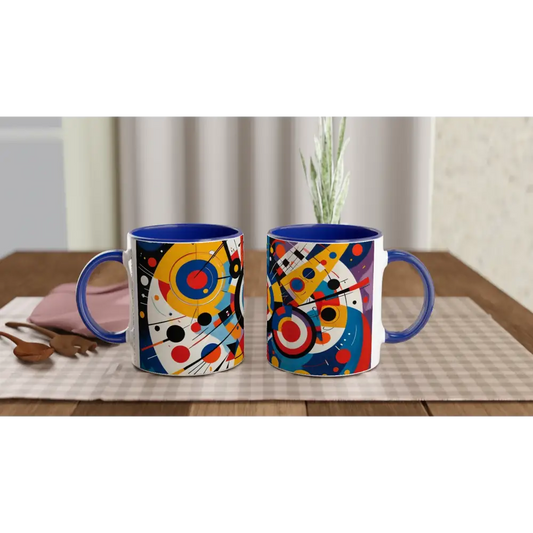 Two blue-handled ceramic mugs with abstract geometric designs from PixiOnyx